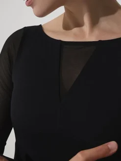 Grishko langærmet dragt i sort med mesh detaljer